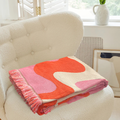 Couverture à motif vague groovy rose et orange